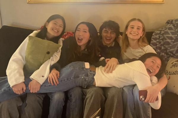 Luca Calgoro-Worrell ‘25, Julia Frazier ‘25, Evelyn Gong ‘25, Maria Hermann ‘25, and Sophia Nakakura get cozy at their annual White Elephant gift exchange.